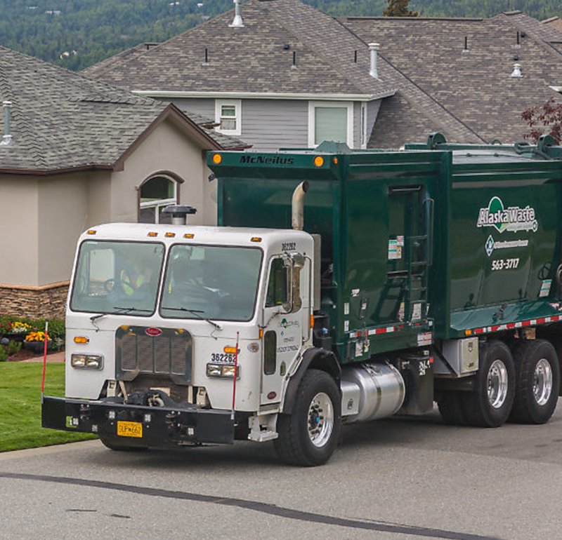 Photo of Alaska Waste Residential Services Truck outside of a home.
